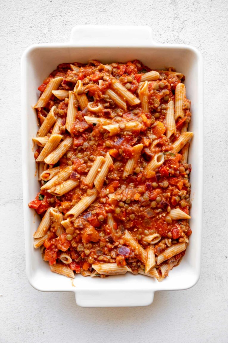 Pasta bake transferred to a casserole dish.