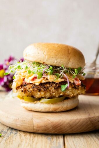 Honey Pepper Pimento Chicken Sandwich on a cutting board.
