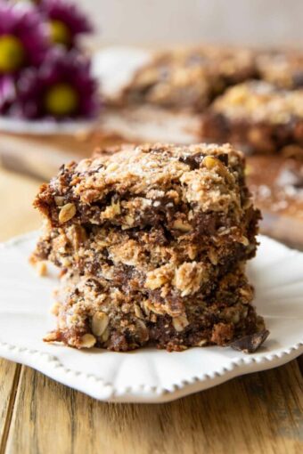 Angled close up of stacked Oatmeal Chocolate Chip Date Bars.