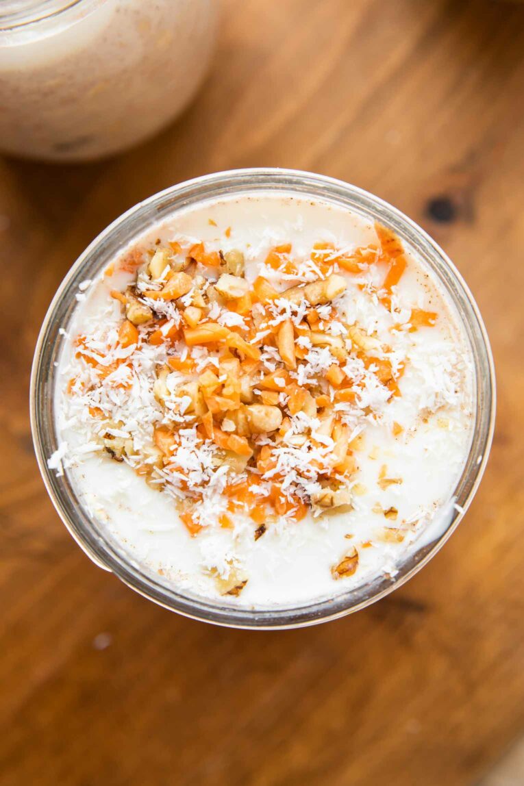 Top shot of Carrot Cake Overnight Oats with white chocolate yogurt topping.