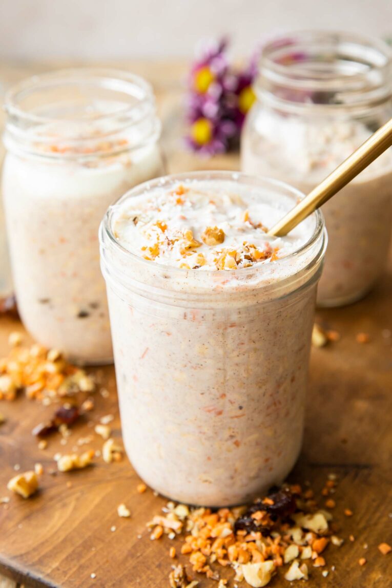 Angled photo of Carrot Cake Overnight Oats in mason jars.
