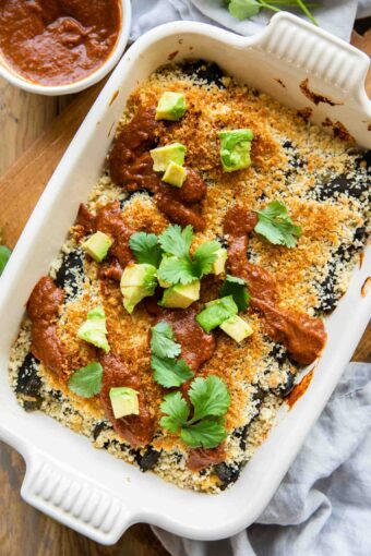 Chile Relleno Casserole with sauce and avocado.