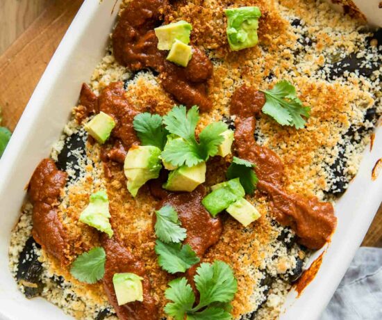 Chile Relleno Casserole with sauce and avocado.
