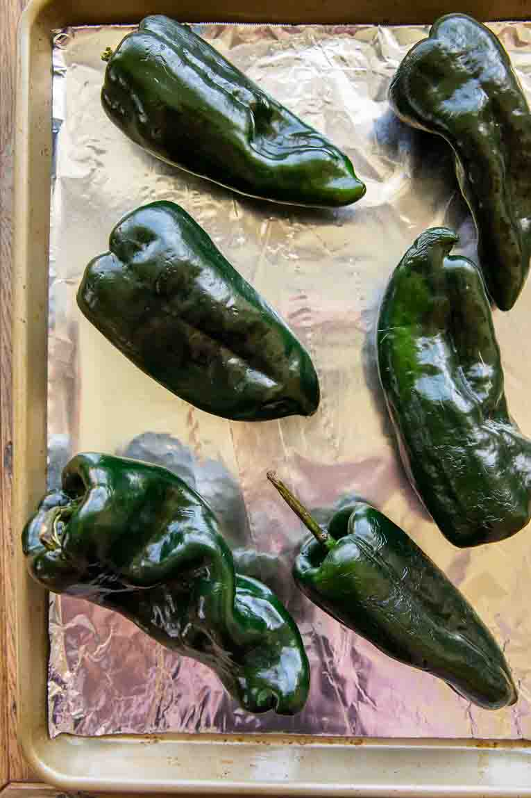 Poblano peppers on a baking sheet.