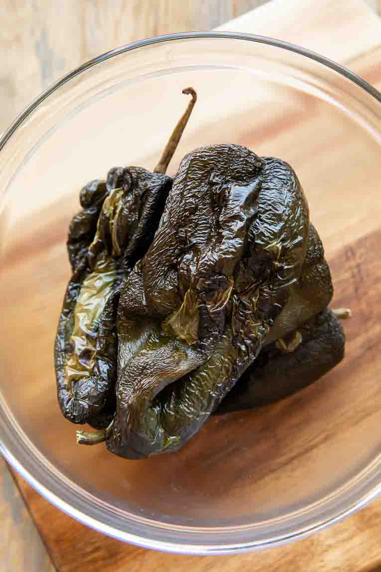 Roasted poblano pepper in a bowl.