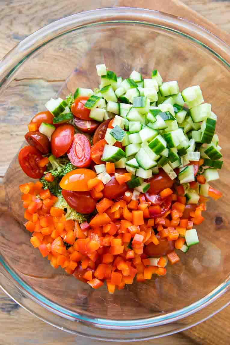 Veggies chopped and combined in a glass bowl.