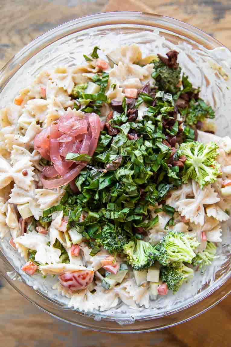 Ingredients for Creamy Vegan Pasta Salad in a large mixing bowl.