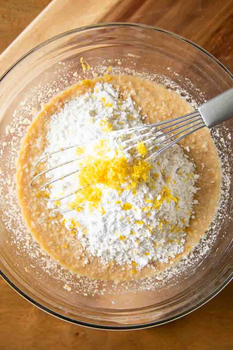 Ingredients for Gluten-Free Lemon Raspberry Muffins in a bowl.