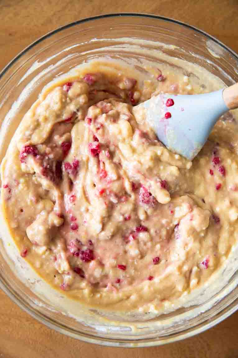 Raspberries folded into gluten-free muffin batter.
