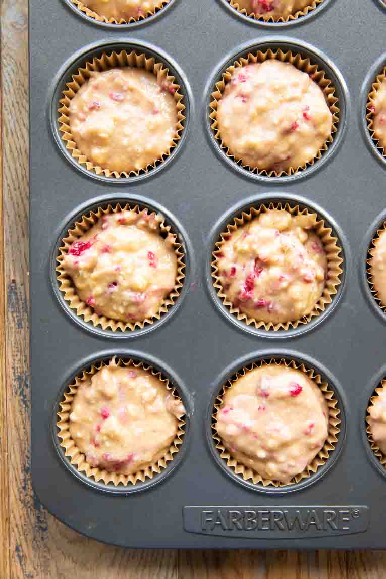 Gluten-Free Lemon Raspberry Muffins batter in a tin.
