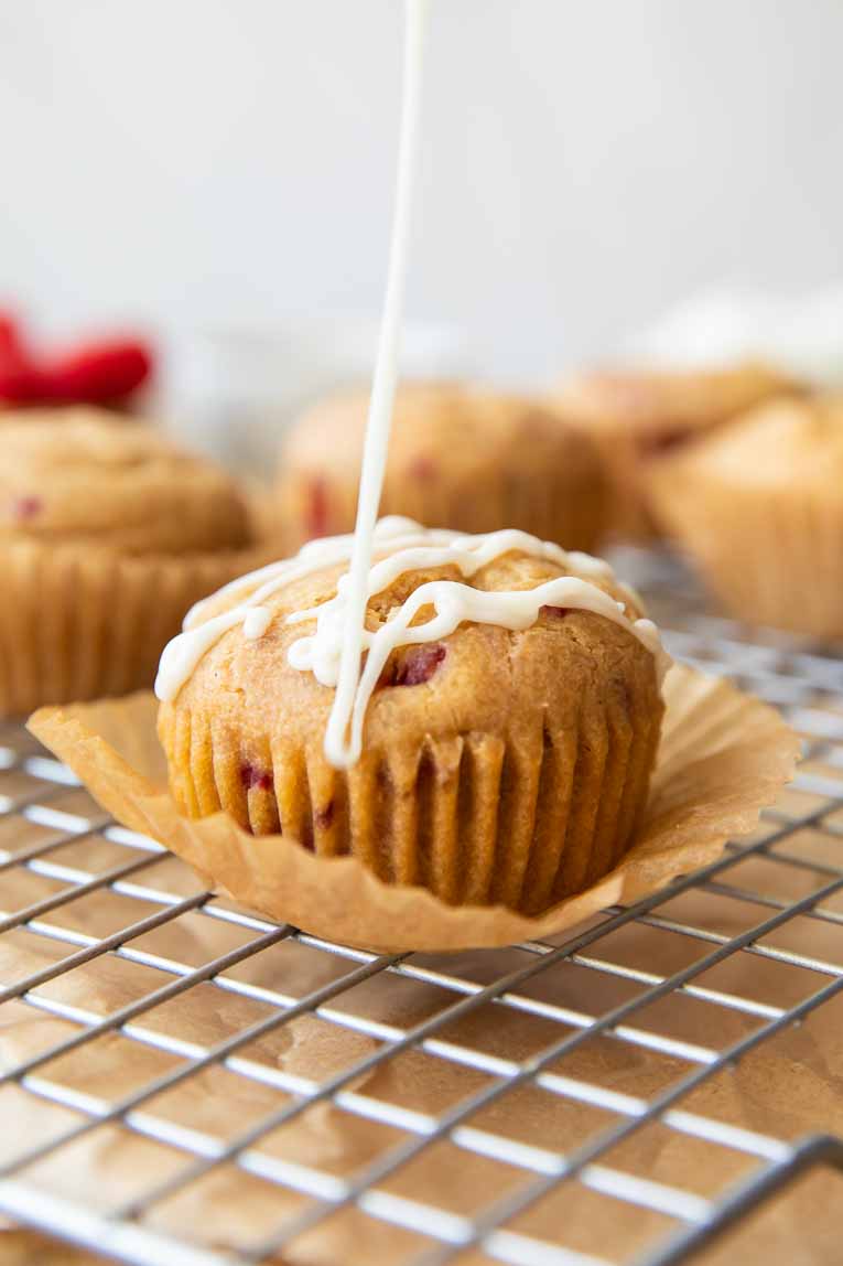 Drizzle of icing over Gluten-Free Lemon Raspberry Muffin.