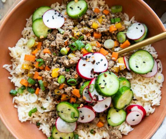 Korean Beef Bowls recipe with radishes and cucumbers.