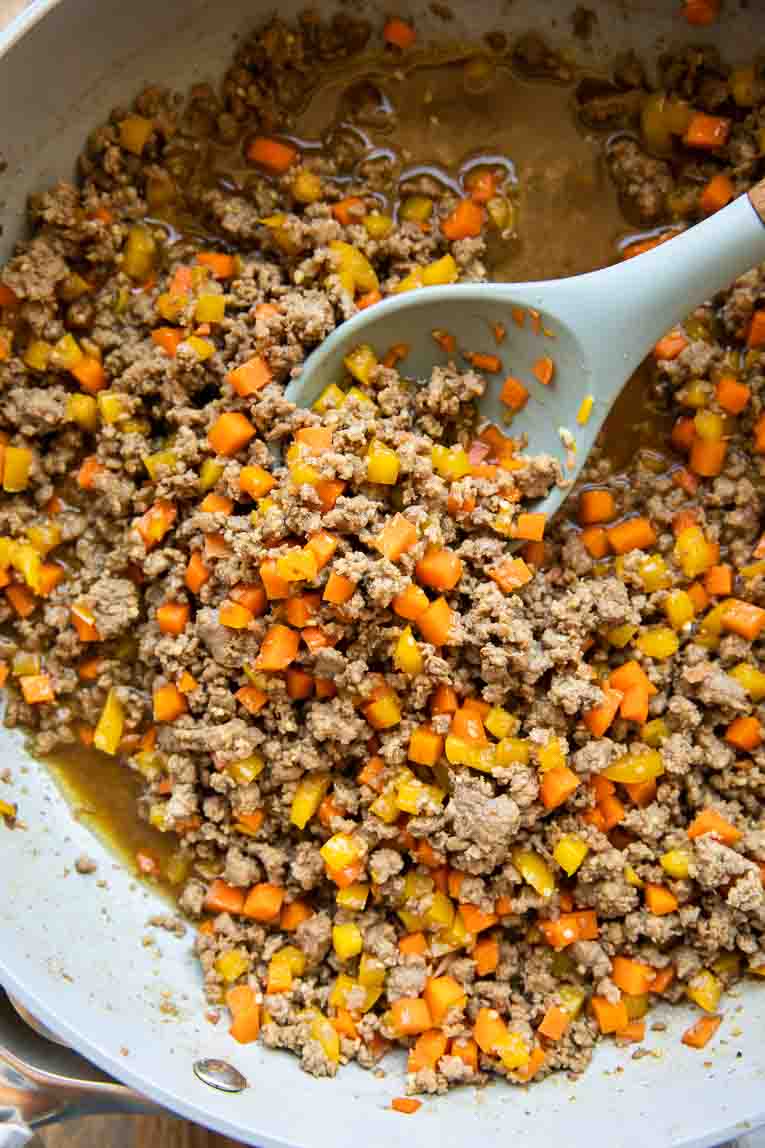Ground beef and veggies being cooked in a sauce for Korean Beef Bowls.