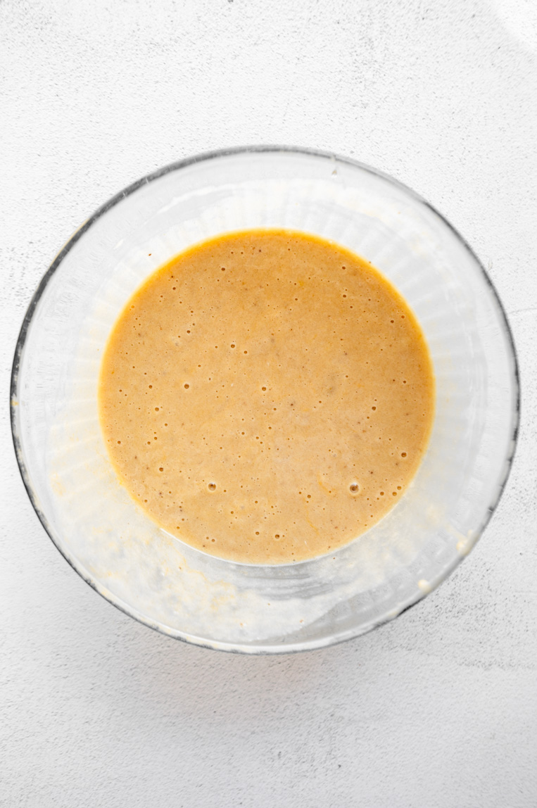 Liquid ingredients for protein banana bread being mixed together.
