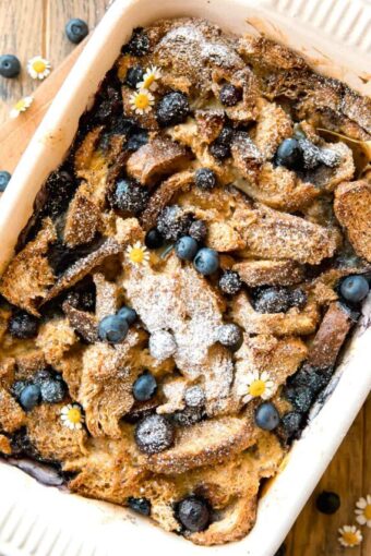 Top photo of Healthy Blueberry French Toast Casserole with a serving spoon.