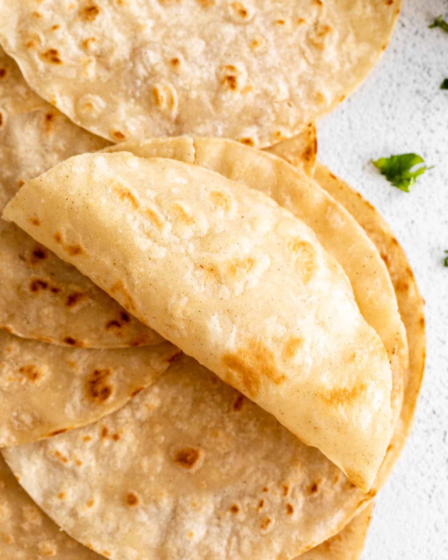 Light, soft Almond Flour Tortillas rolled up.