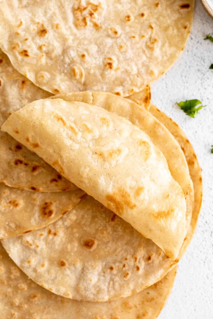 Light, soft Almond Flour Tortillas rolled up.