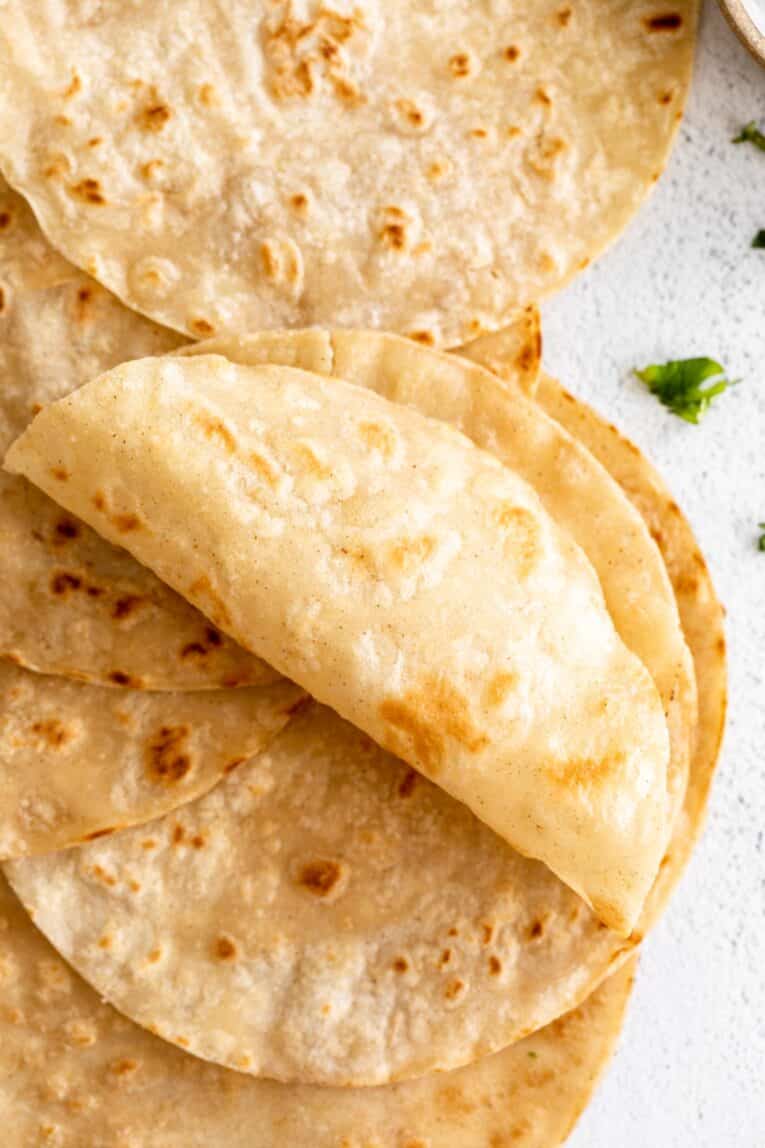 Light, soft Almond Flour Tortillas rolled up.