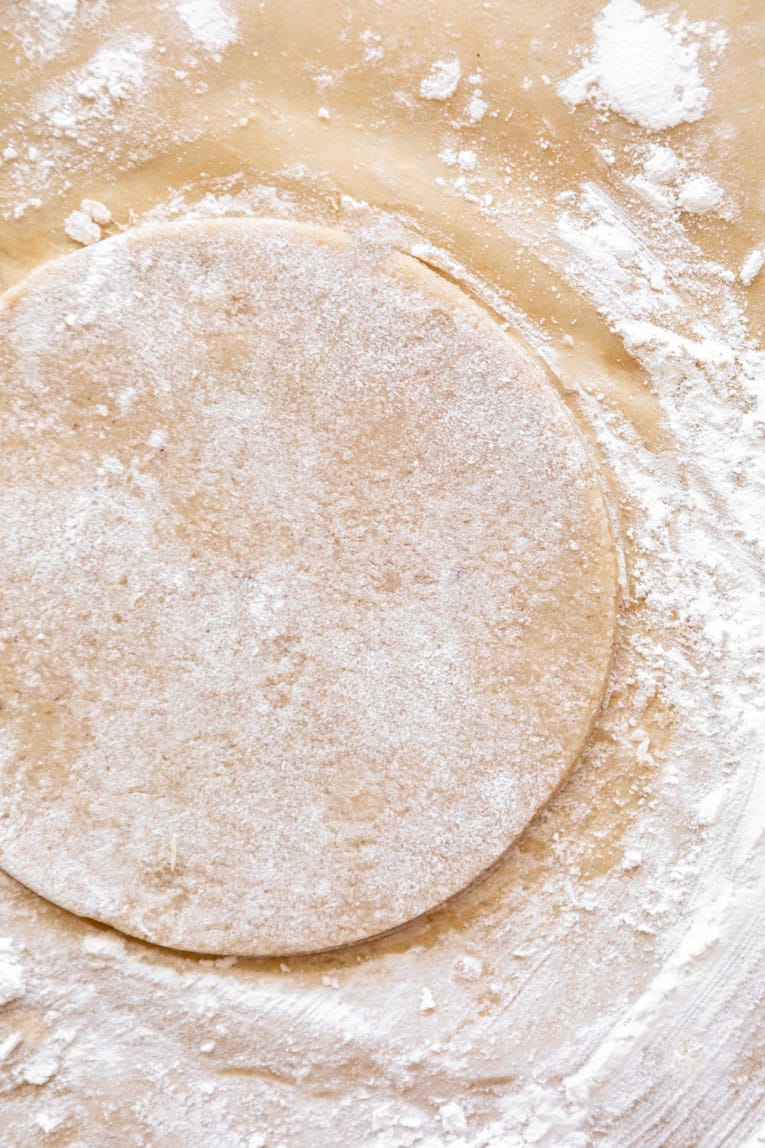 Almond Flour tortillas being pressed or flattened.