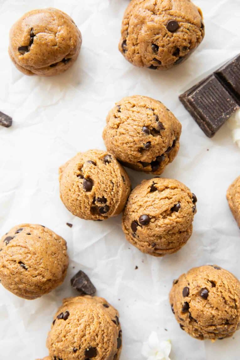 Chocolate Chip Cookie Dough Energy Bites on parchment paper.