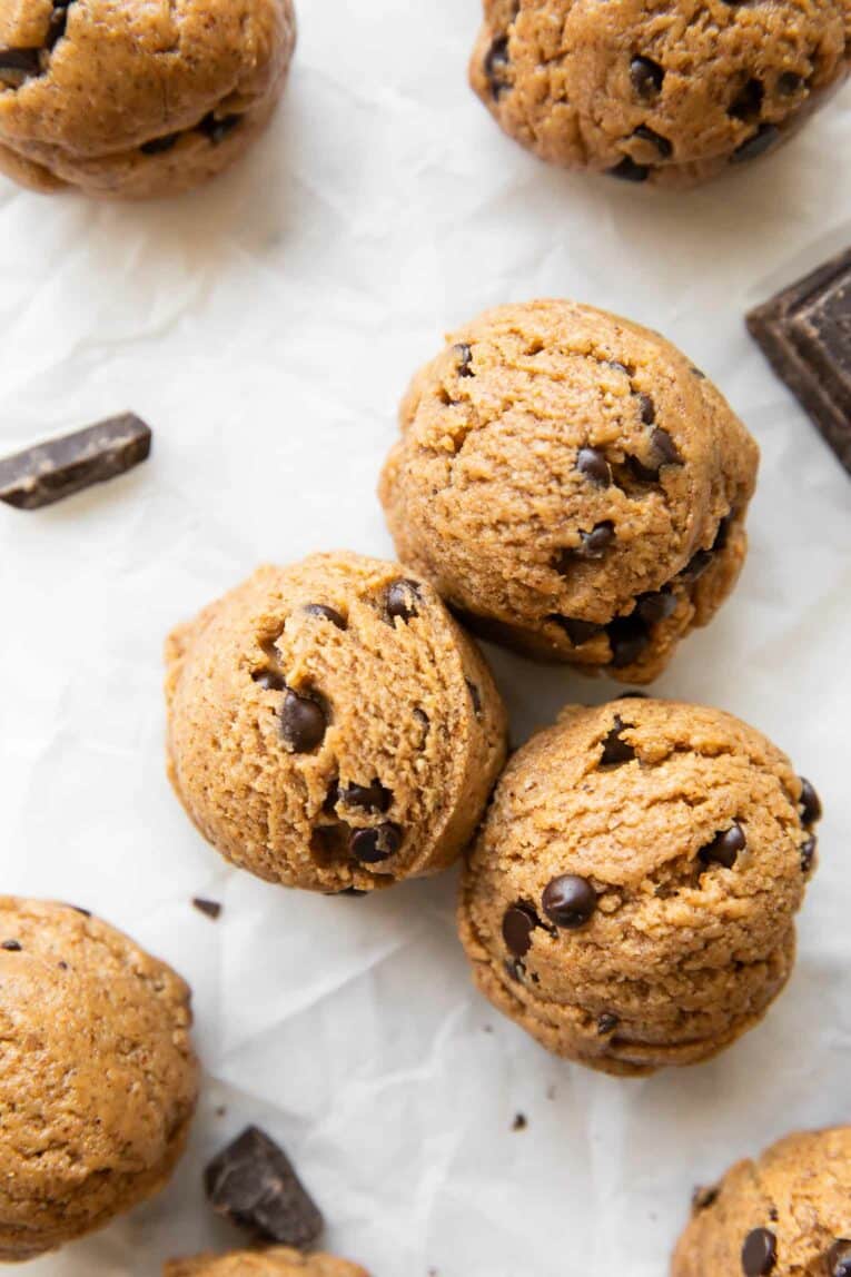 Close up of 3 Chocolate Chip Cookie Dough Energy Bites.