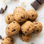 Chocolate Chip Cookie Dough Energy Bites stacked on top of each other.