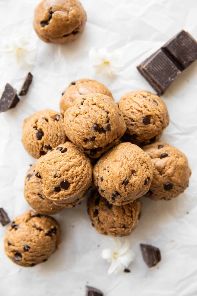 Chocolate Chip Cookie Dough Energy Bites stacked on top of each other.