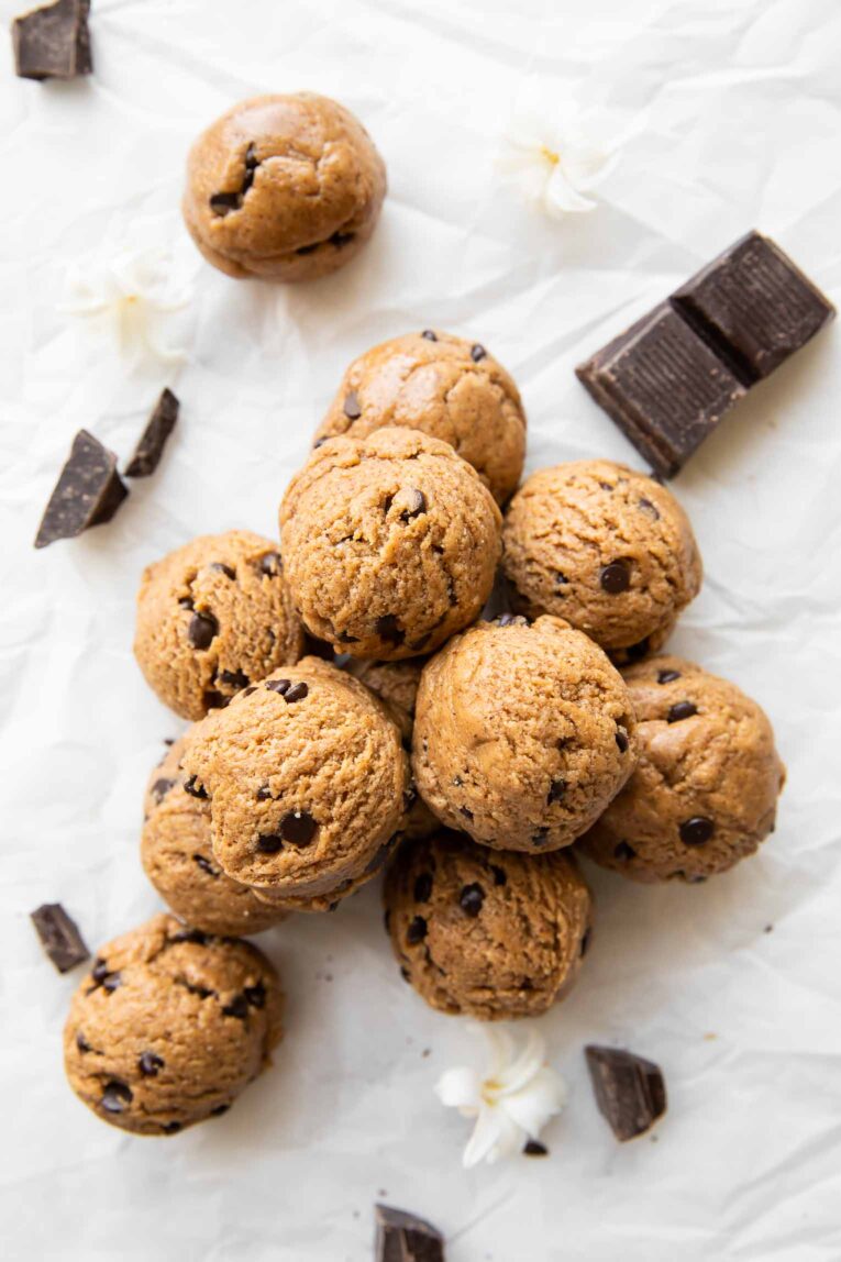 Chocolate Chip Cookie Dough Protein Bites recipe on parchment paper.