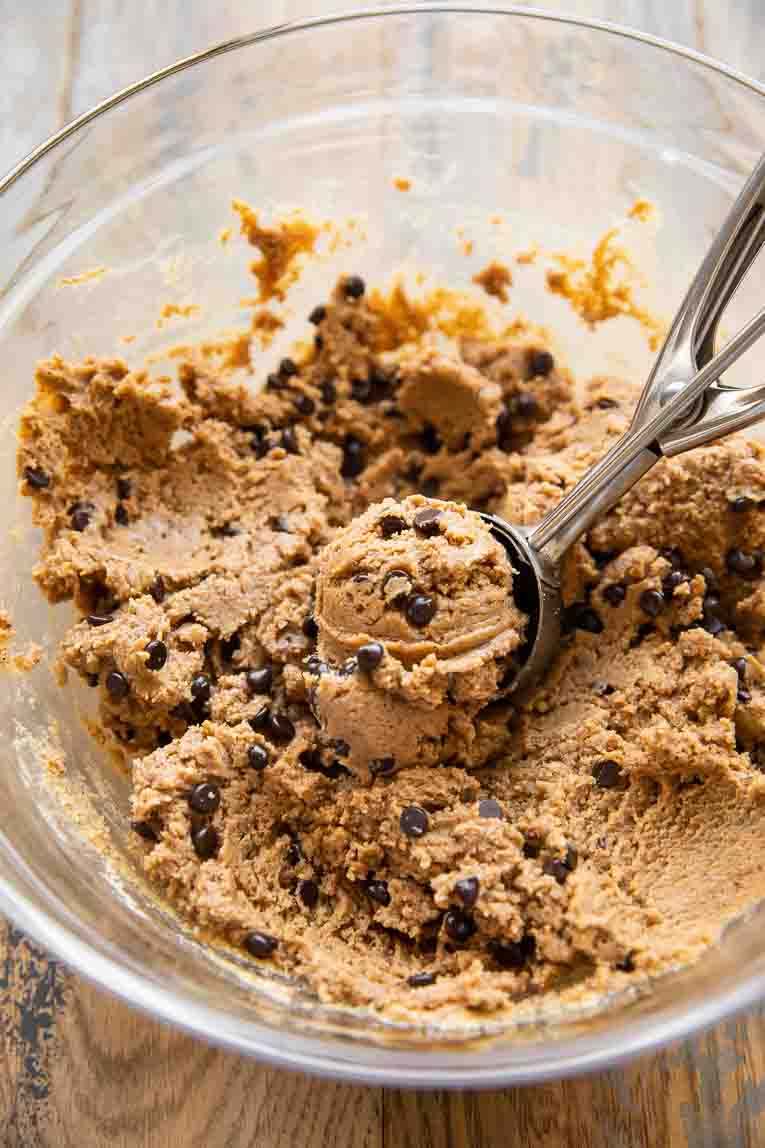 Edible protein cookie dough being scooped out.