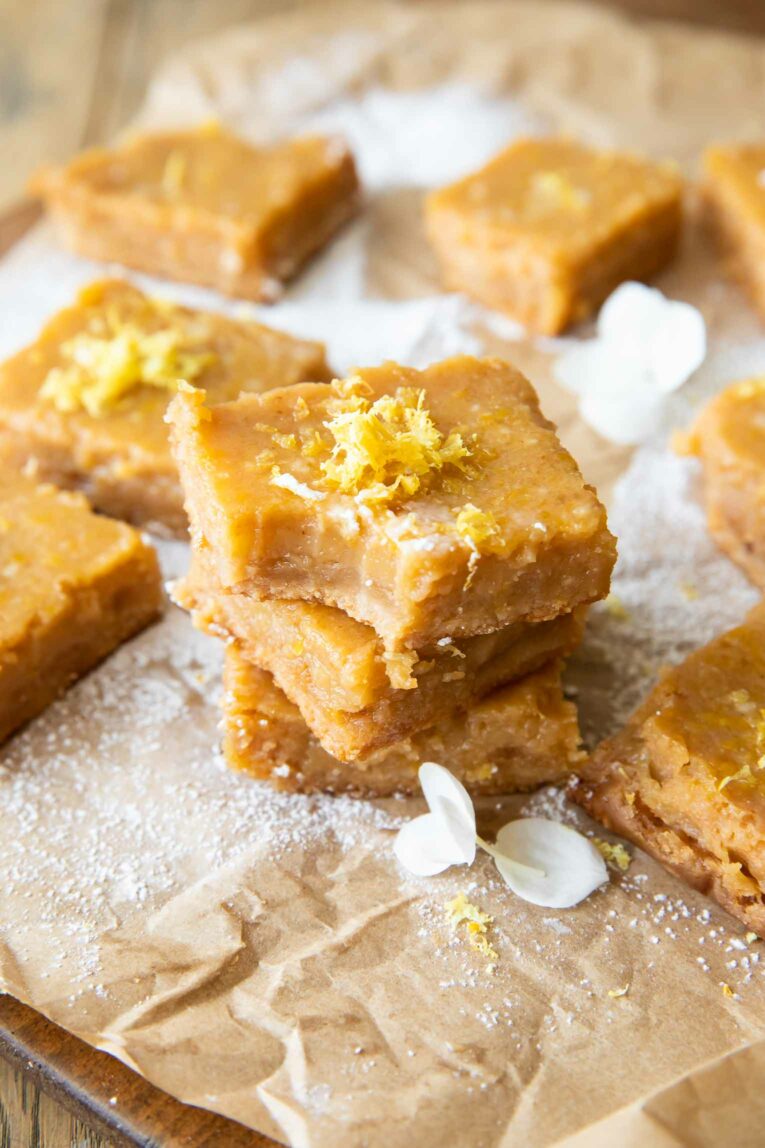 Angled photo of Gluten-Free Lemon Bars with a bite taken out.