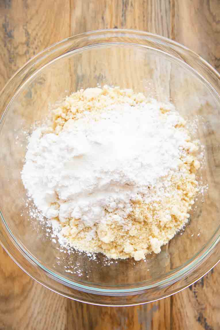 Ingredient for almond flour shortbread crust in a mixing bowl.