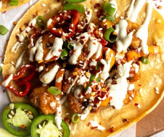 Top shot close up of Kung Pao Shrimp Tacos with Jalapeño Sauce.