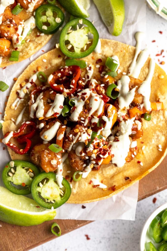 Top shot close up of Kung Pao Shrimp Tacos with Jalapeño Sauce.