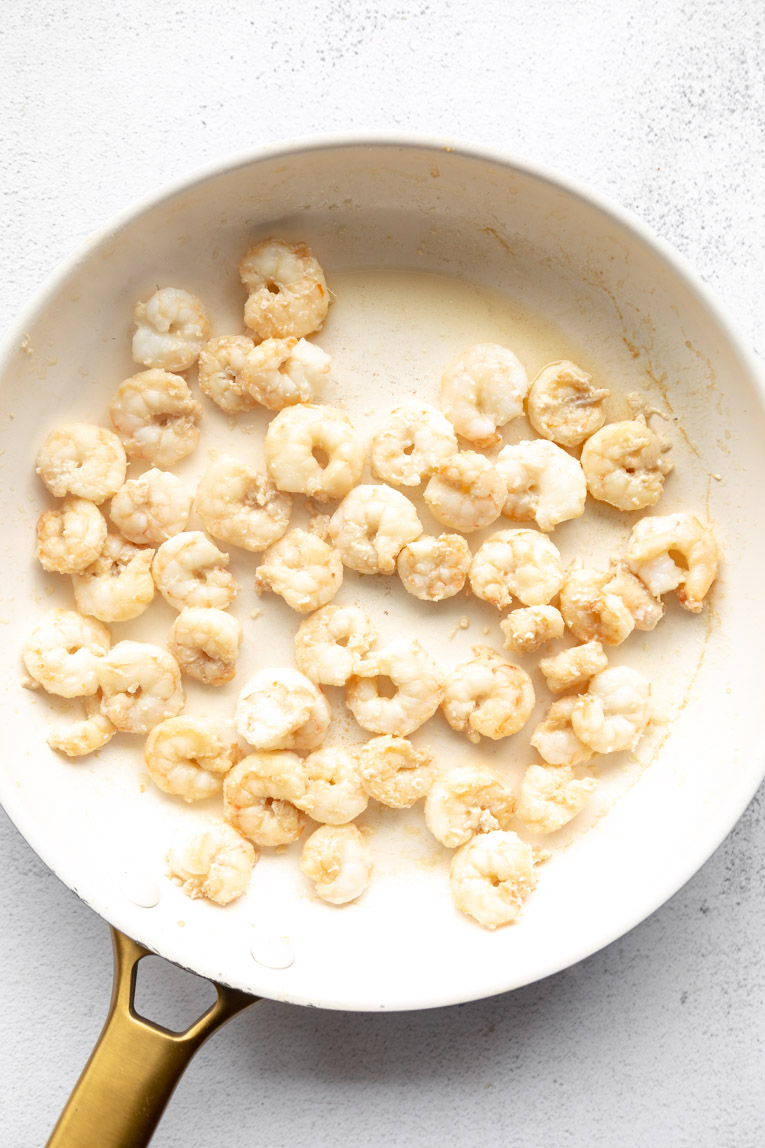 Shrimp being cooked in a pan.