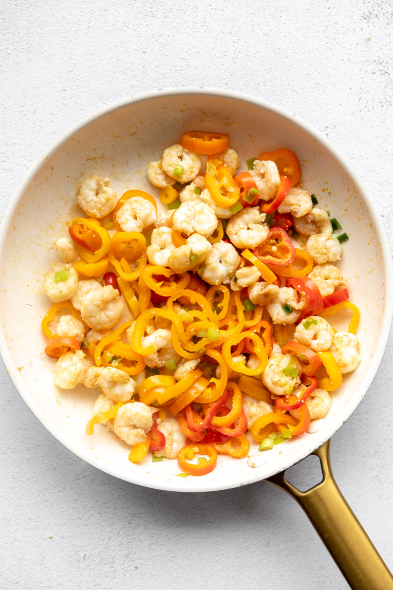 Shrimp cooked with peppers and green onions for Kung Pao shrimp.