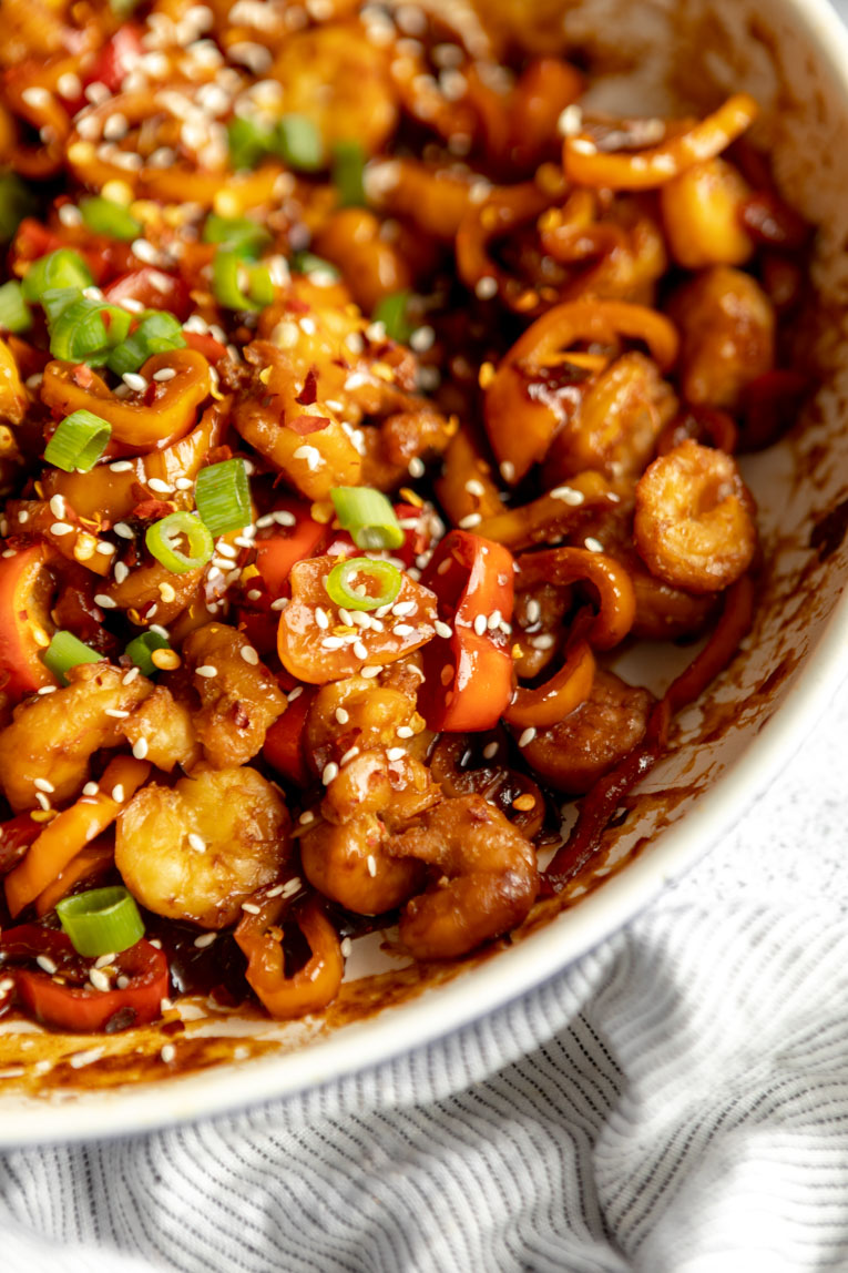 Kung pao shrimp cooked in a pan.