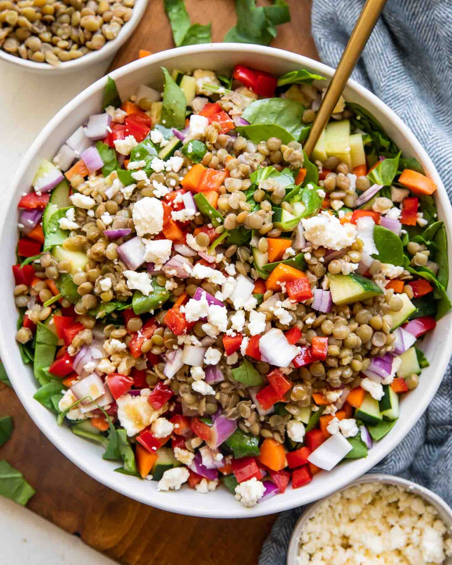 Lemon Balsamic Lentil Salad top shot photo in a bowl with ingredients around it.