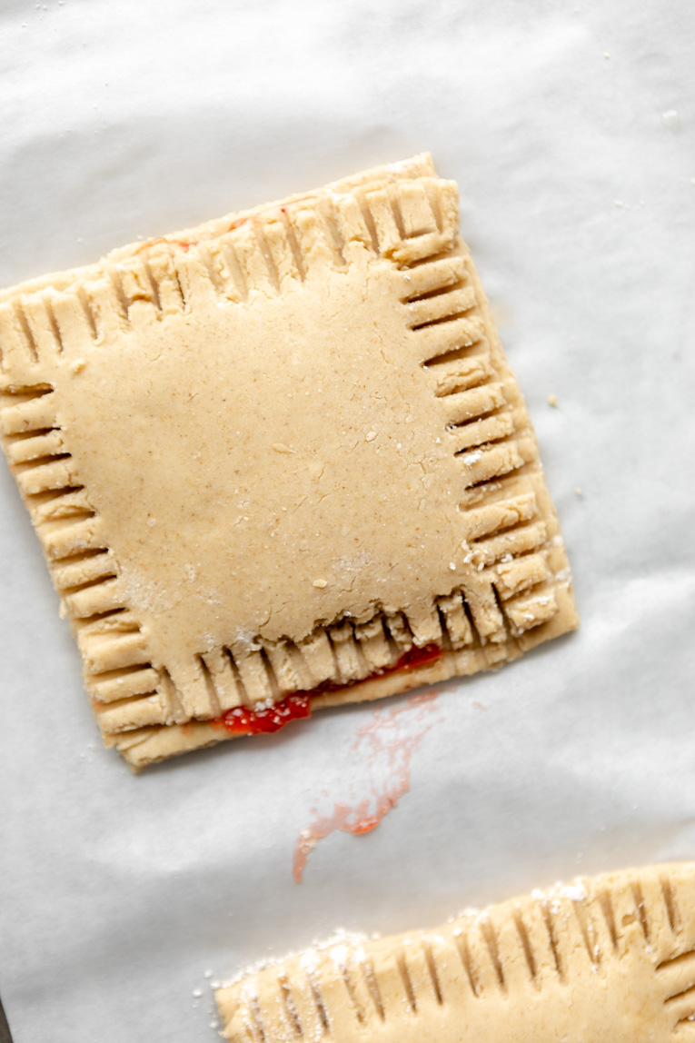 Pop tarts dough and filling pressed together for baking.