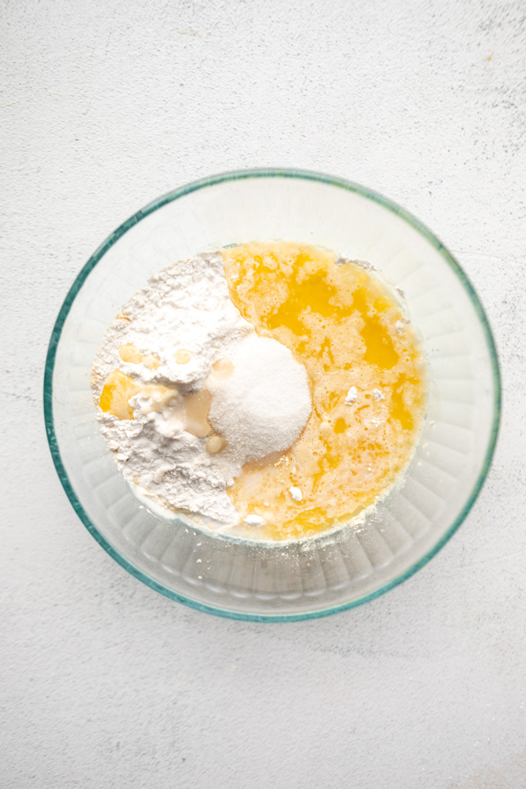 Butter, milk, and dry ingredients for gluten-free pop tarts in a mixing bowl.