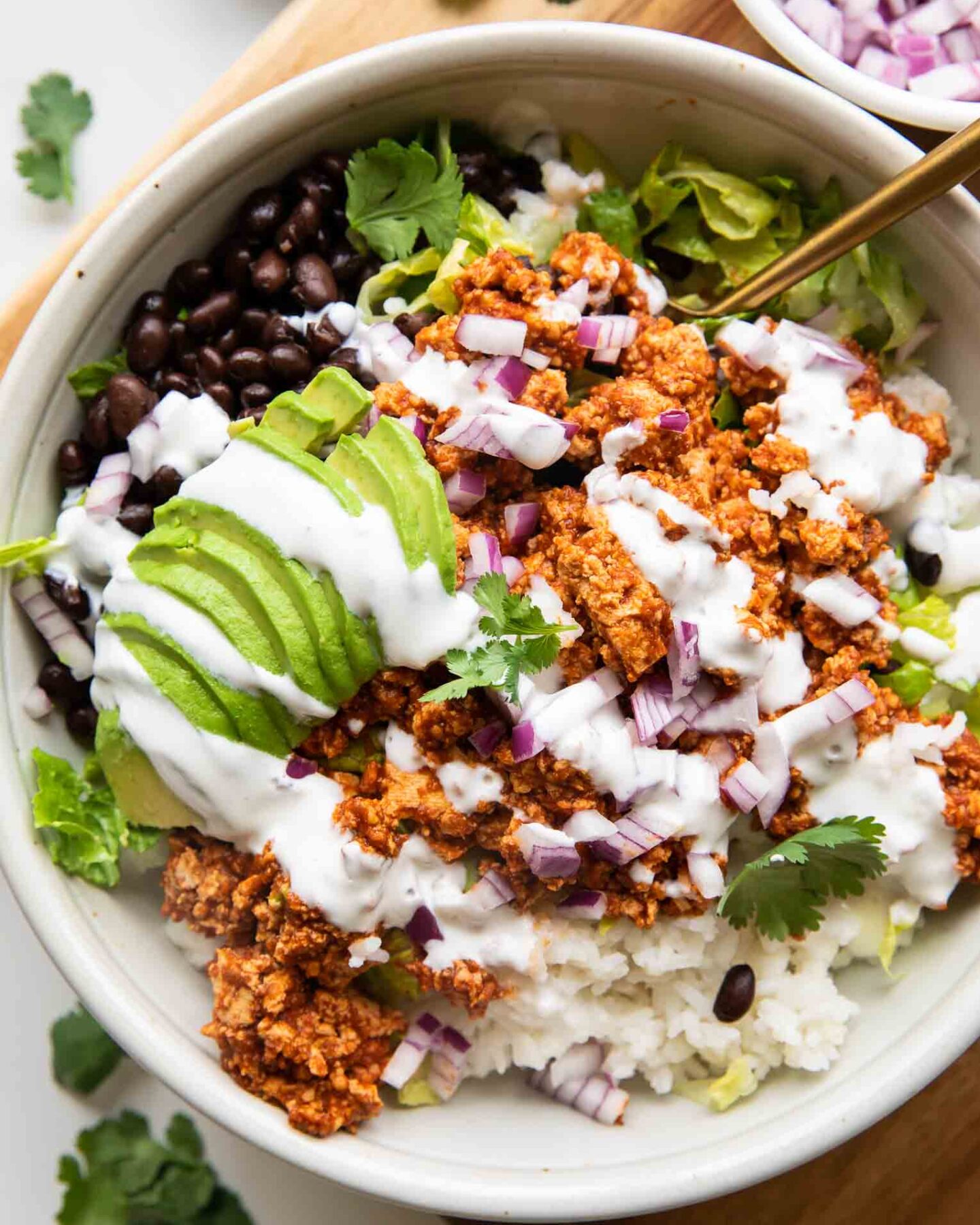 Sofritas Meal Prep Bowl with avocado, cilantro, and sour cream.