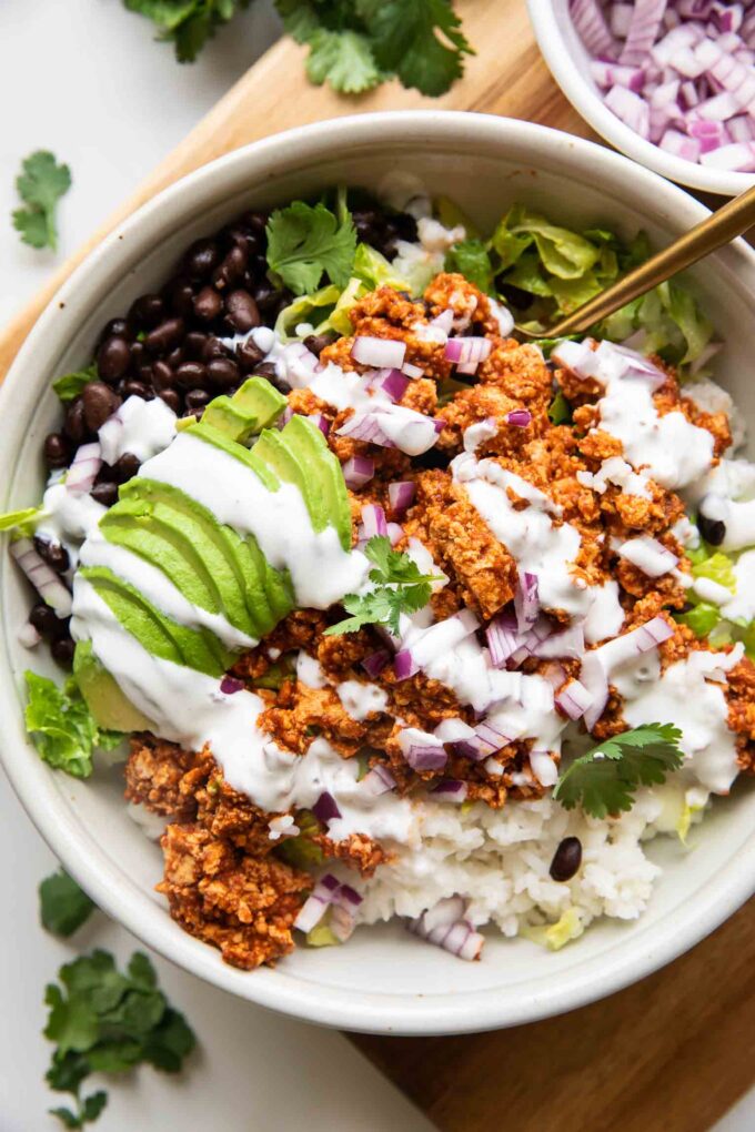 Sofritas Meal Prep Bowl with avocado, cilantro, and sour cream.