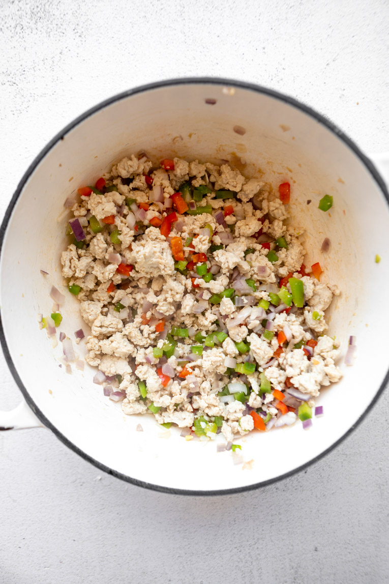 Rotel mixed with ground turkey cooked in a dutch oven.
