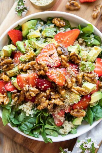 Avocado Strawberry Spinach Salad recipe in a bowl.