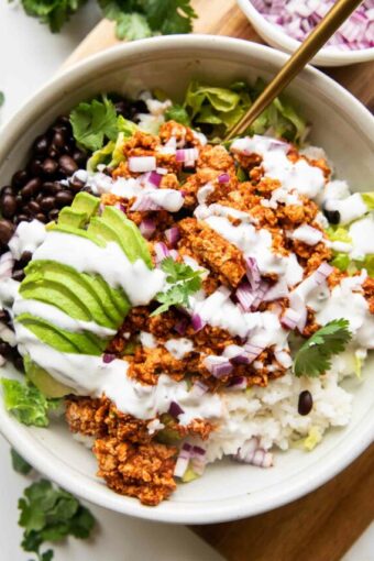 Sofritas recipe in a bowl with rice and beans.