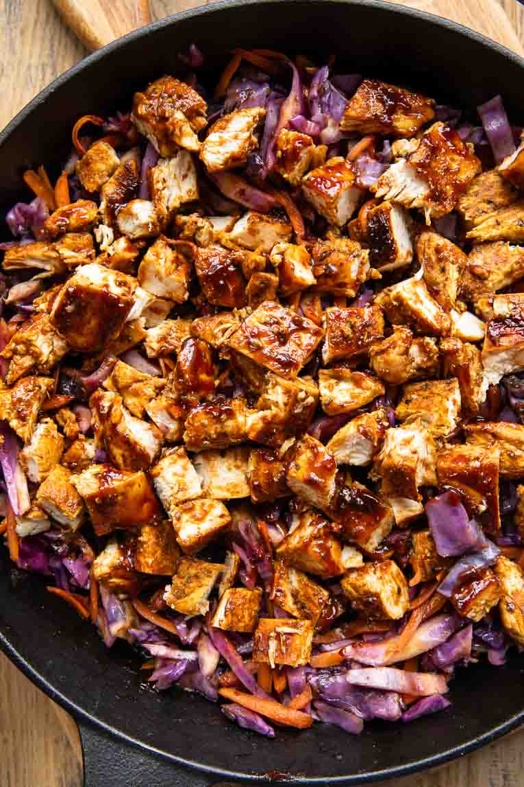 Barbecue chicken cooked in a cast iron skillet.