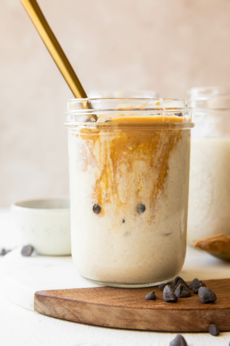 Close up of Blended Overnight Oats in a jar with peanut butter.