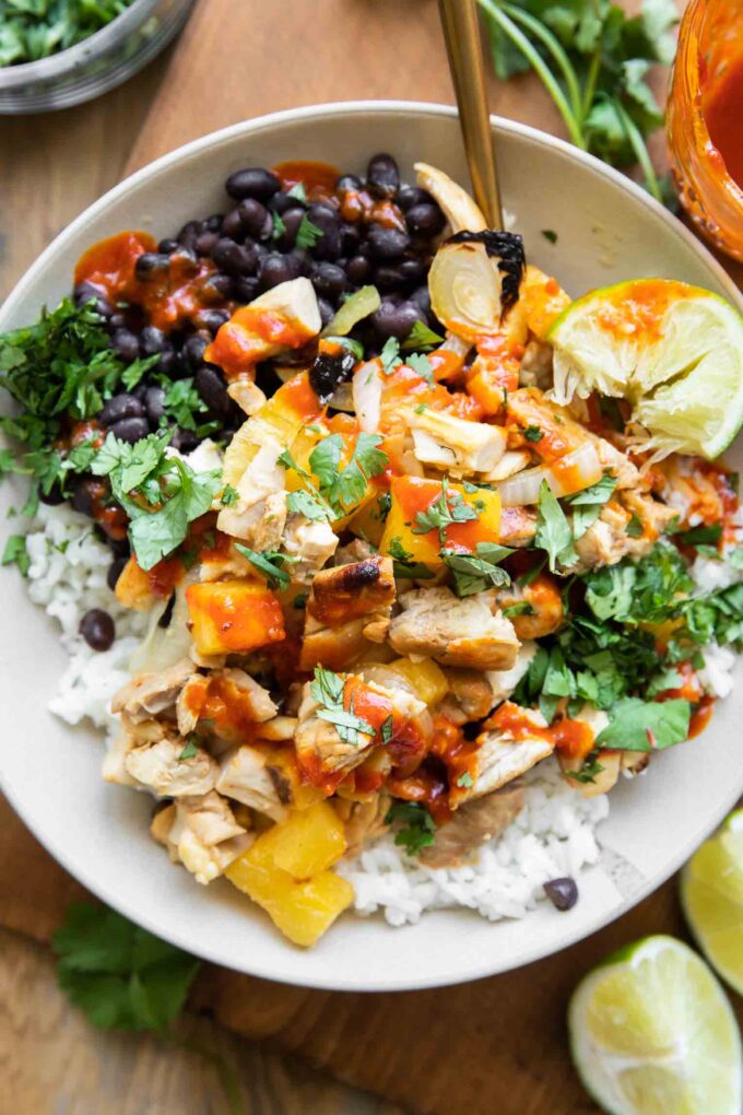Al pastor chicken recipe in a meal prep bowl.
