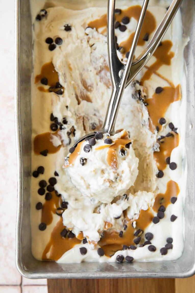 Frozen Cottage Cheese Ice Cream in a metal tin with scoop.
