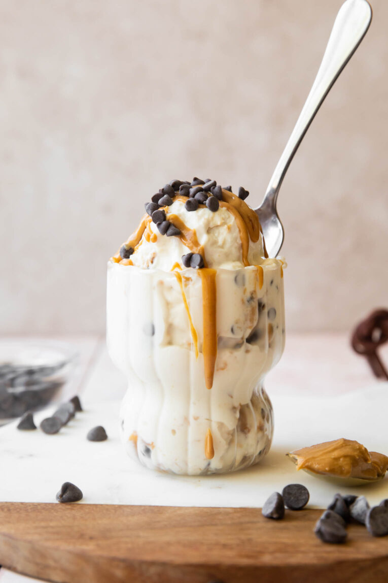 Cottage Cheese Ice Cream in a parfait glass with a spoon.