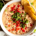 Healthier Rotel Dip in a bowl with tortilla chips.